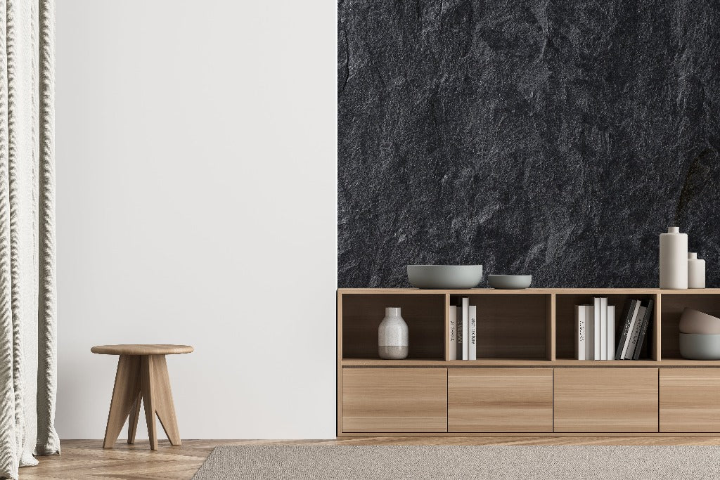 Living Room - Modern minimalist living room featuring a Decor2Go Wallpaper Mural, wooden storage unit with books and decorative items, small wooden stool, and a cream curtain.