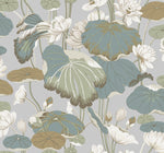 A botanical pattern featuring large lotus leaves in shades of green, blue, and brown, surrounded by white lotus flowers and buds. The background is a light gray, enhancing the delicate and natural elegance of the flora depicted. This Lotus Pond Cotton/Peacock Wallpaper Green, Pink (60 Sq.Ft.) by York Wallcoverings ensures easy installation and removal.