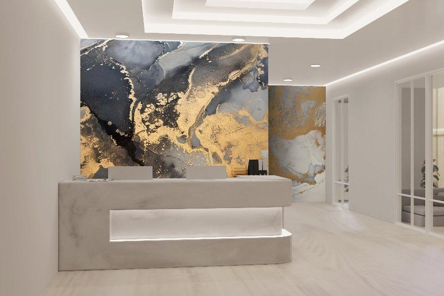 Reception area featuring a modern, minimalist design. The focal point is a white marble desk with an illuminated front panel. The back wall is adorned with the luxurious Luminous Marble Wallpaper Mural by Decor2Go Wallpaper Mural, complete with metallic highlights. It showcases a large abstract artwork in dark blue, gold, and white. The room is well-lit with recessed ceiling lights and has clean white walls.