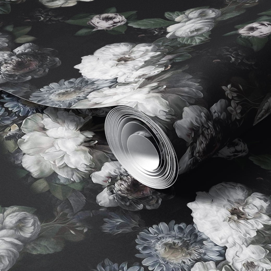 Decor2Go's Midnight Bloom Floral Wallpaper Mural features a dark backdrop with large white and light gray flowers accented by green leaves. This premium roll is partially unrolled, revealing its detailed design.