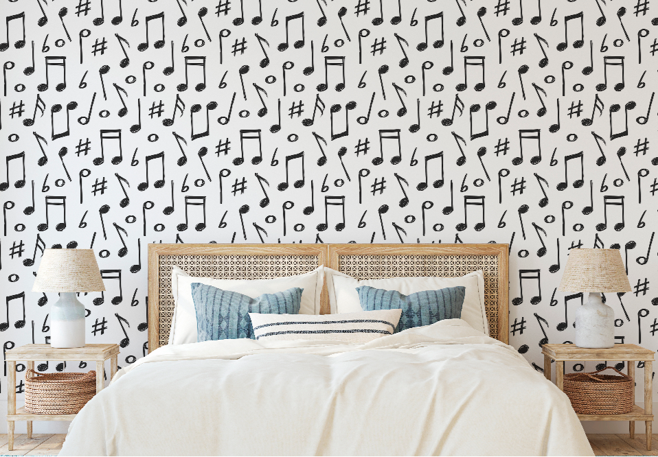 A modern bedroom featuring a bed with a woven headboard against Decor2Go Wallpaper Mural adorned with black musical notes and hashtags, flanked by matching wicker nightstands with lamps.