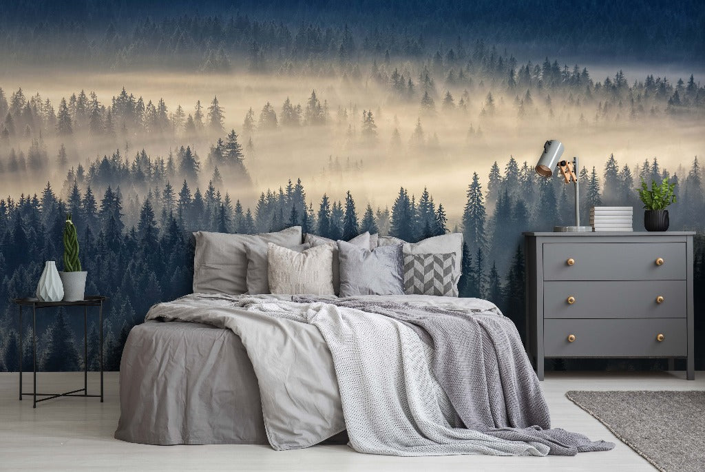 A stylish bedroom with a Mysterious Forest-themed mural on the wall, featuring a king-sized bed with gray bedding, a side table, dresser, and a small plant, all set against a serene fog from Decor2Go Wallpaper Mural.