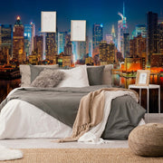 Bedroom - A stylish bedroom setup with a large bed covered in white and gray bedding and a plush throw, facing an expansive Decor2Go Wallpaper Mural through the wall-sized window.