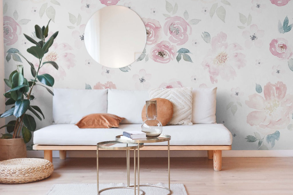 Living Room - A cozy living room with a white sofa, Decor2Go Wallpaper Mural, and a round mirror. Modern gold tables hold books and a glass vase, and a potted plant adds a green touch.