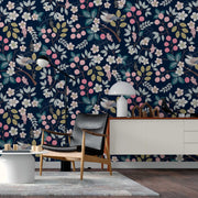 Living Room - A cozy living room corner featuring a stylish armchair, white sideboard with books and decor, and a floor lamp, against a vibrant feature wall in shades of blue, pink, and yellow by Decor2Go Wallpaper Mural's Nature's Bliss Wallpaper Mural.