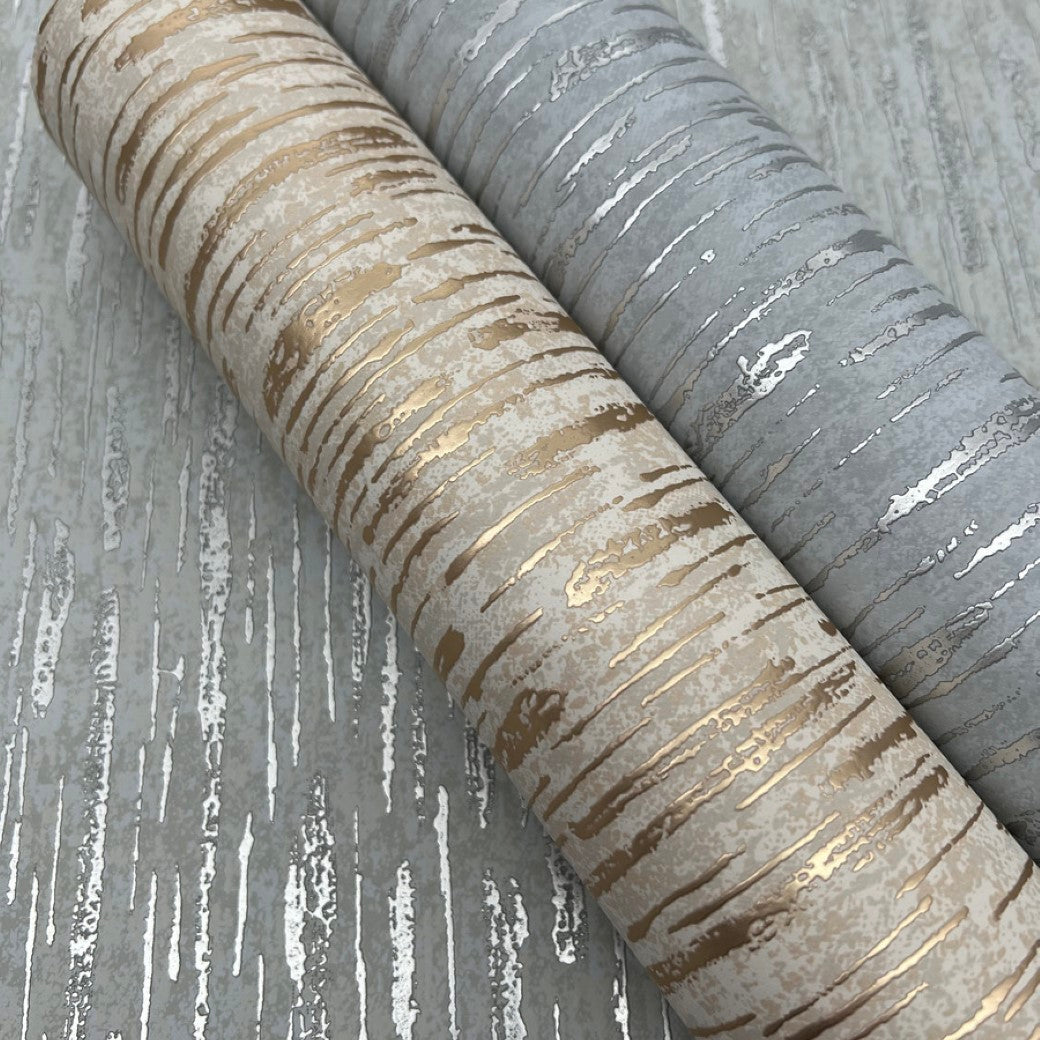 The Neutral & Silver Nazca Wallpaper by York Wallcoverings features a bark-like textured pattern ideal for modern interiors. It comes in shimmering light gold and dazzling silver, with muted background tones creating a natural yet elegant vibe, covering 57 SqFt per roll.