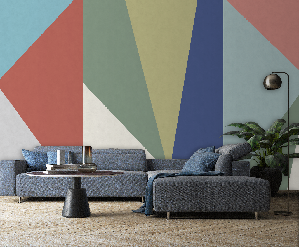 Living Room - A modern living room featuring a blue sectional sofa with cushions, a Decor2Go Wallpaper Mural, a round black coffee table, a floor lamp, and a large potted plant.