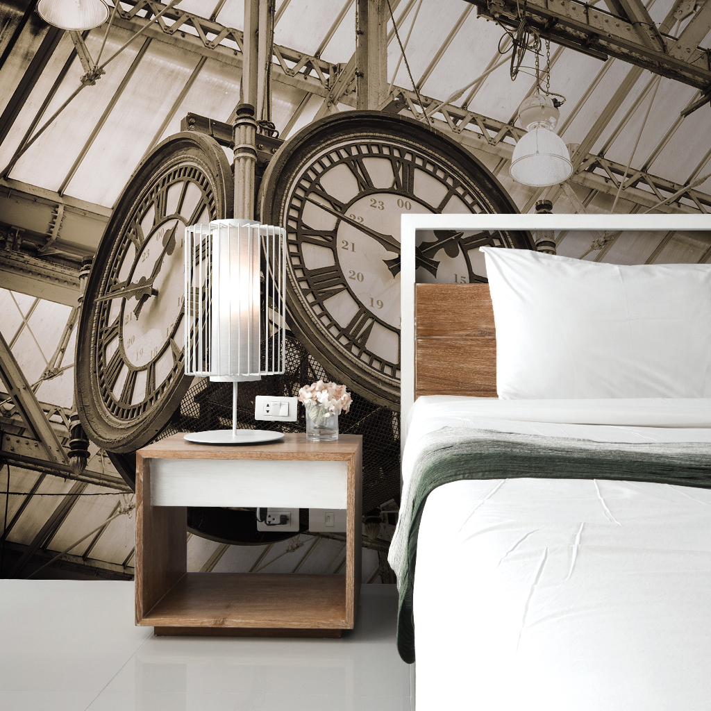 A creative bedroom design incorporating a large, Decor2Go Wallpaper Mural as the headboard, with a modern bed and bedside table in a minimalistic style, set against an industrial-style roof structure.