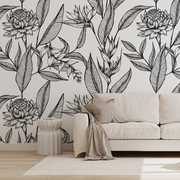 Living Room - A modern living room featuring a beige sofa against a wall adorned with large black and white Decor2Go Wallpaper Mural. A small round coffee table, beige rug, and draped throw complete the scene.