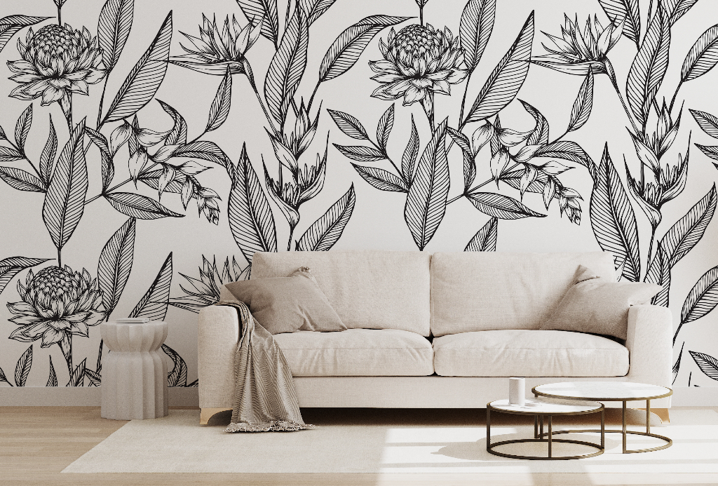 A modern living room featuring a beige sofa against a wall adorned with large black and white Decor2Go Wallpaper Mural. A small round coffee table, beige rug, and draped throw complete the scene.