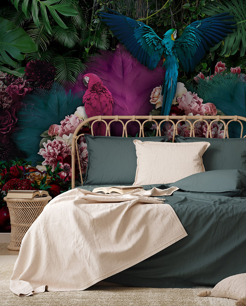 Bedroom - A vibrant bedroom with a tropical paradise theme, featuring a bed with dark green bedding and a beige throw. The Parrot Paradise Wallpaper Mural from Decor2Go Wallpaper Mural is adorned with colorful jungle foliage and flowers, with majestic parrots perched throughout.