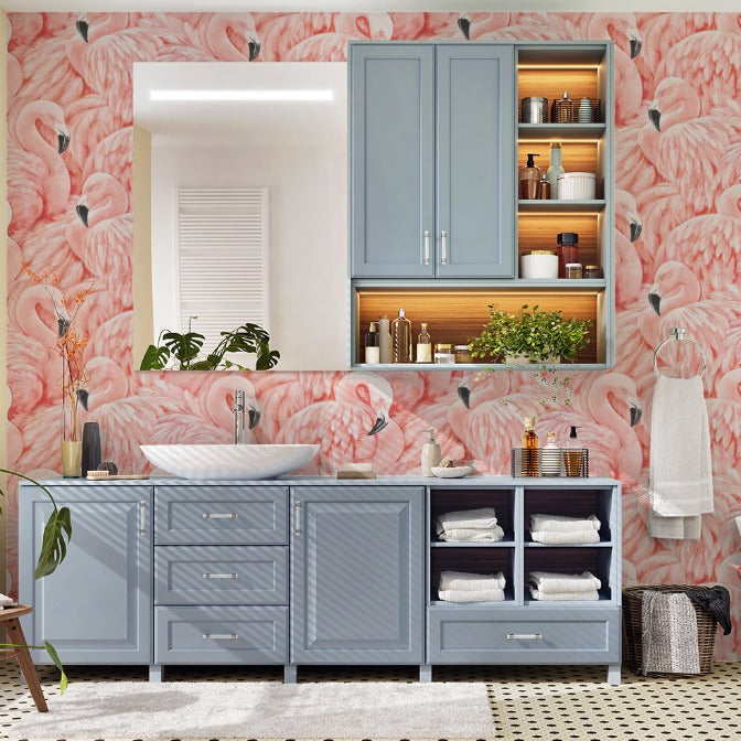A vibrant bedroom with Decor2Go Wallpaper Mural's Pink Flamingos Mural Wallpaper, featuring a blue vanity and shelving unit against a sunny window, surrounded by plants and modern amenities.