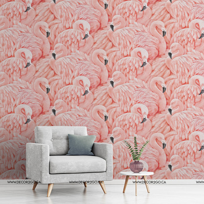 Bedroom - A stylish bedroom with a gray armchair and small side table with a plant, against a vibrant pink wall covered in a repeating Decor2Go Wallpaper Mural.