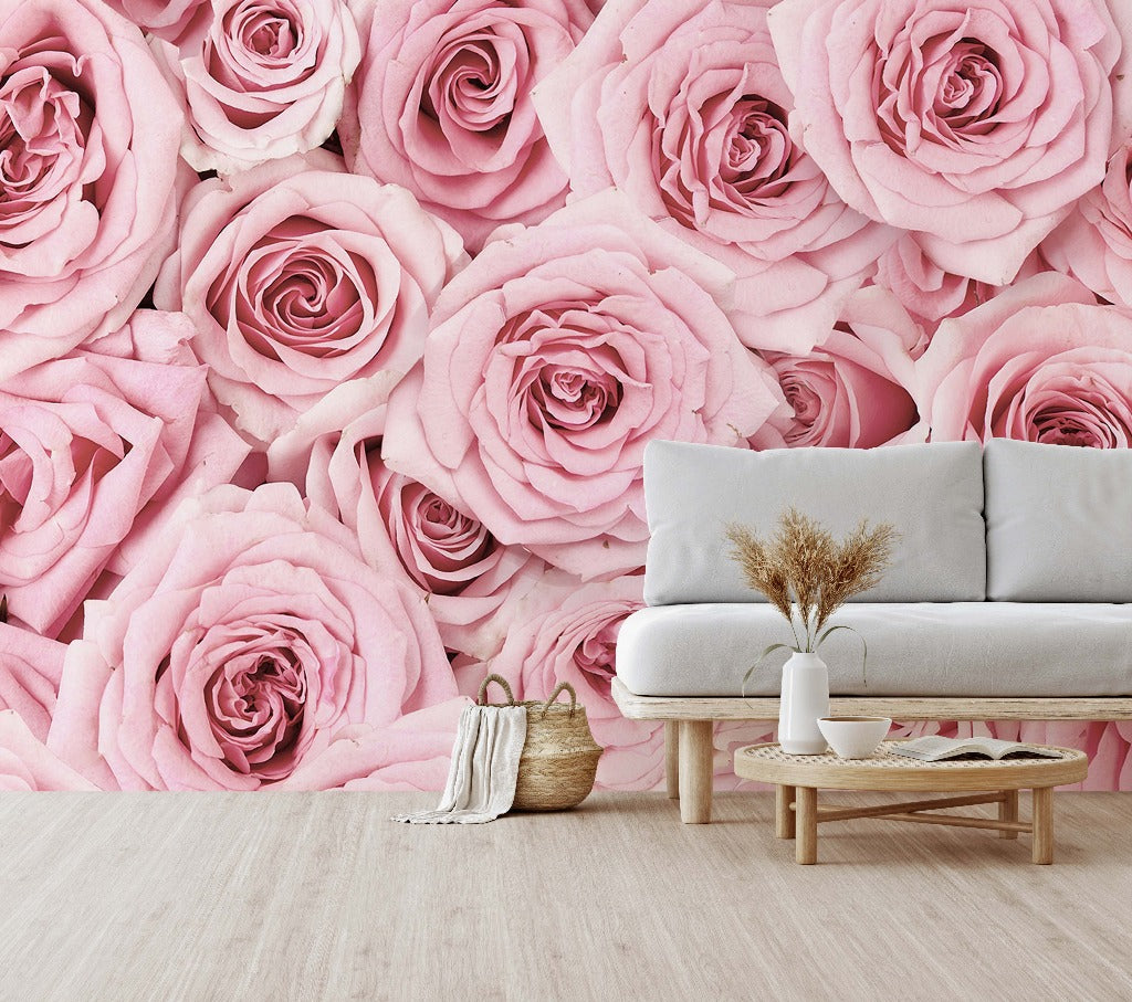 Living Room - A stylish living room with a large Pink Paradise wallpaper mural from Decor2Go Wallpaper Mural, featuring a white sofa, a small wooden table with a vase of dried plants, and a woven basket.