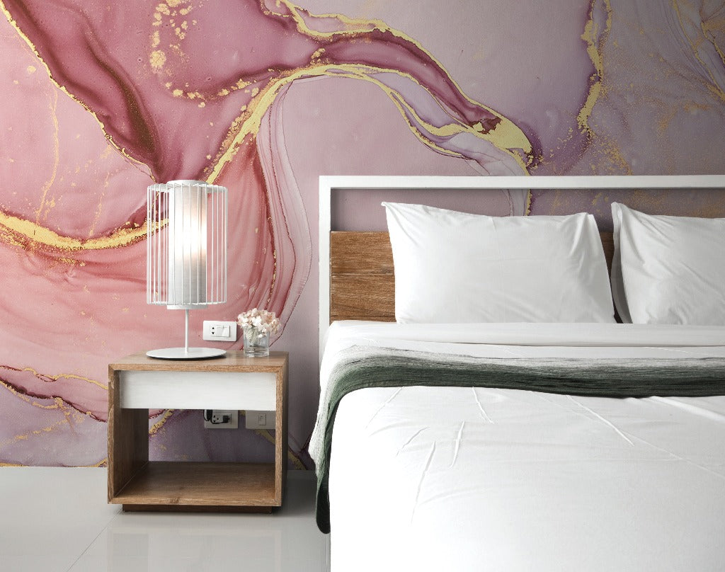 Bedroom - A stylish bedroom with a large bed featuring white bedding and a wooden headboard, a small wooden bedside table with a modern lamp, and a vivid Decor2Go Pink and Gold Marble Wallpaper Mural in the background.