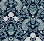 Intricate pattern featuring stylized peacocks with fanned tails and elaborate floral motifs, including large blooms and leaves, all in shades of blue, green, and white on a dark background. This Plume Dynasty Peacock & Floral Wallpaper - Navy (60 SqFt) from York Wallcoverings brings an elegant touch to any room.