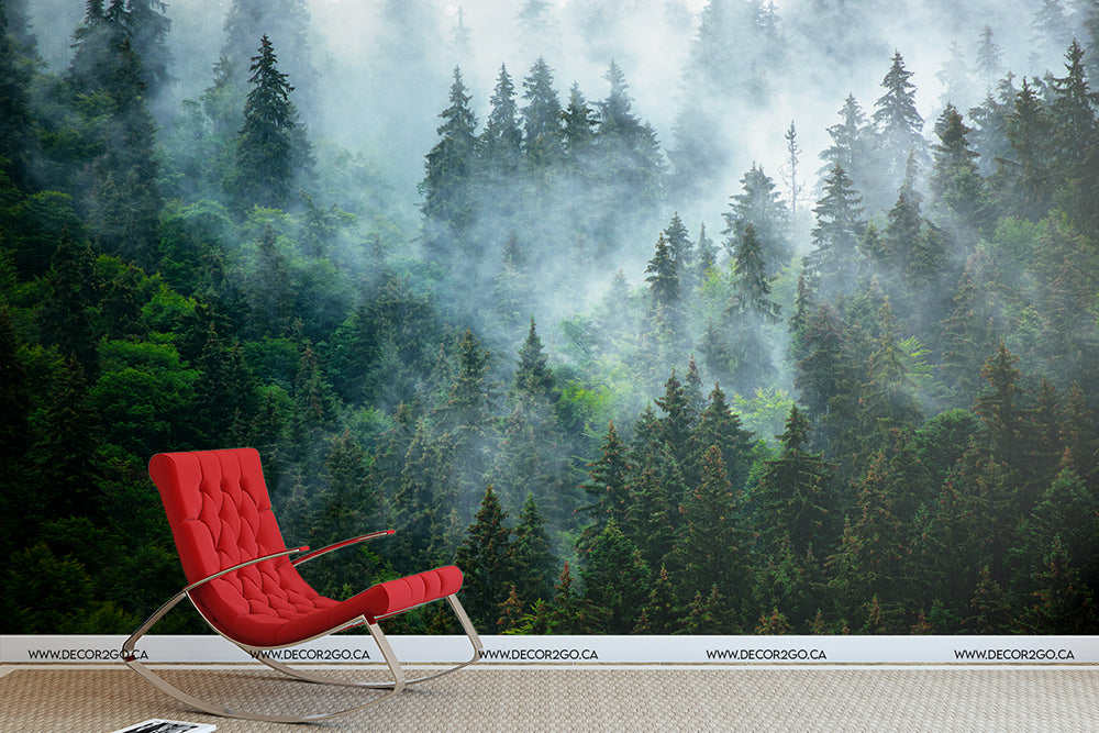 A modern red lounge chair in a room with Decor2Go Wallpaper Mural depicting Reaching Tree Tops, creating a serene and natural indoor setting.