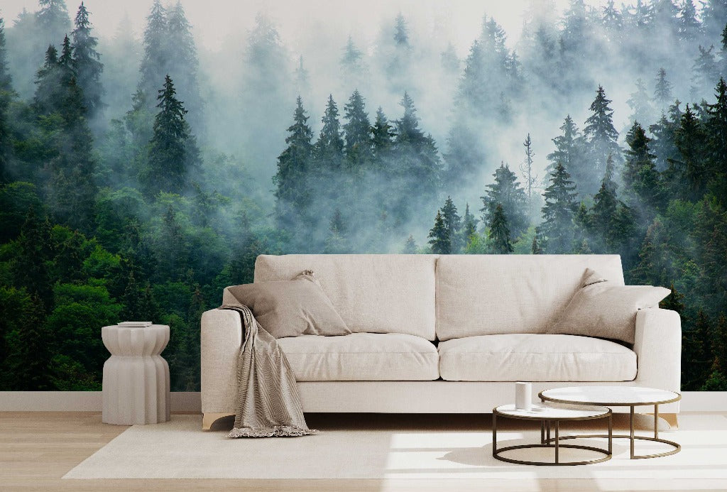 A modern living room with a beige sofa, small tables, and a decorative vase, set against a Decor2Go Wallpaper Mural of Reaching Tree Tops.