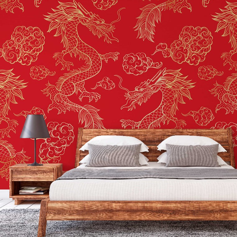 A modern bedroom featuring a Decor2Go Wallpaper Mural in Red Dragon design with intricate golden designs. The room includes a wooden double bed with white bedding and two bedside lamps.