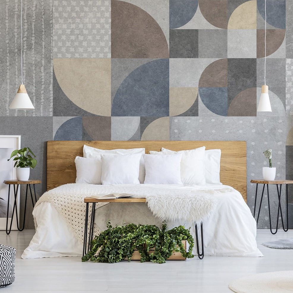 Modern bedroom with Decor2Go Retro Abstract Geometry Wallpaper Mural, a wooden bed with white bedding, side tables, pendant lights, and a shelving unit decorated with plants and books.