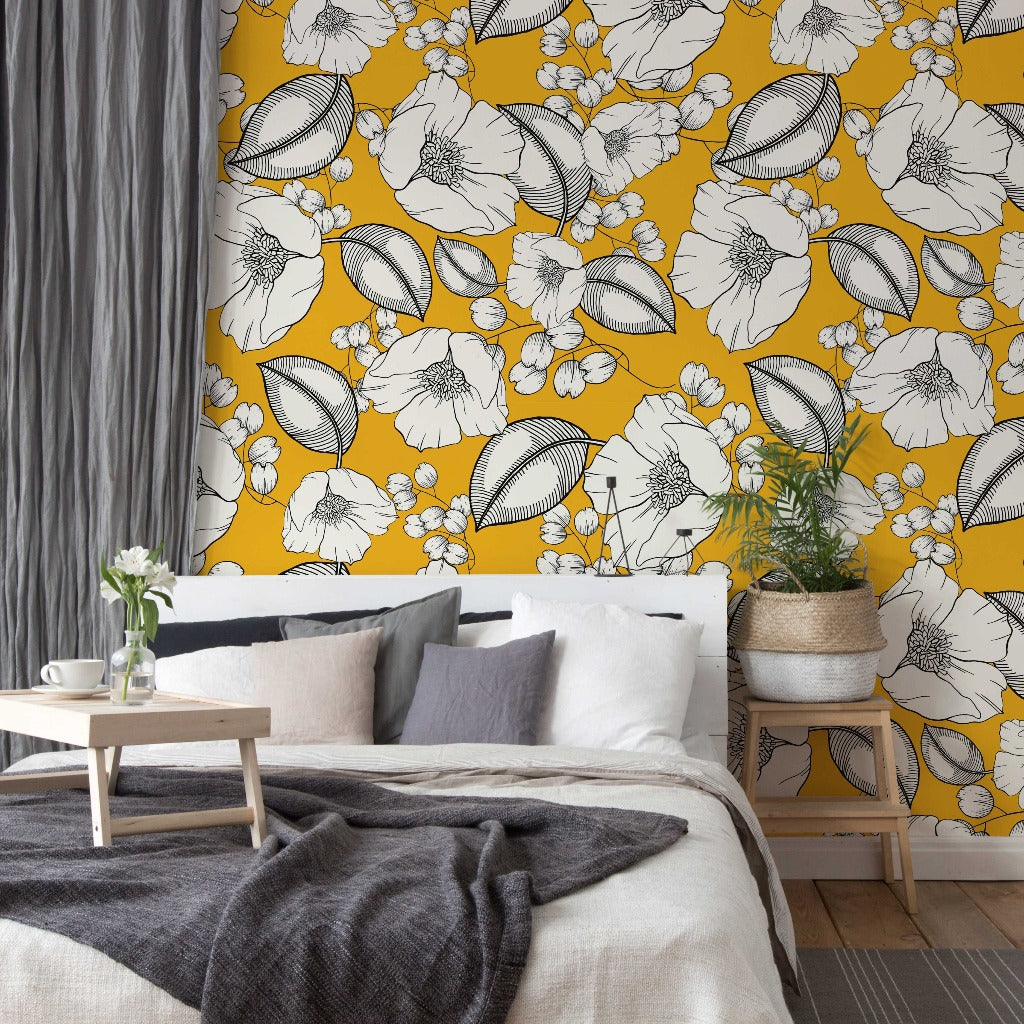 Bedroom - A stylish bedroom featuring a bold yellow Decor2Go Wallpaper Mural, a cozy bed with neutral bedding, a small wooden coffee table, and a potted plant in the corner. Gray curtains complement the room's decor.