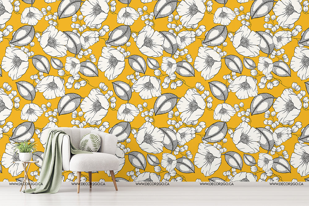 Living Room - A modern living room featuring Decor2Go Wallpaper Mural with a vibrant yellow wall with a floral and leaf pattern. There's a stylish white armchair with green cushions, a side table, and a plant, creating.