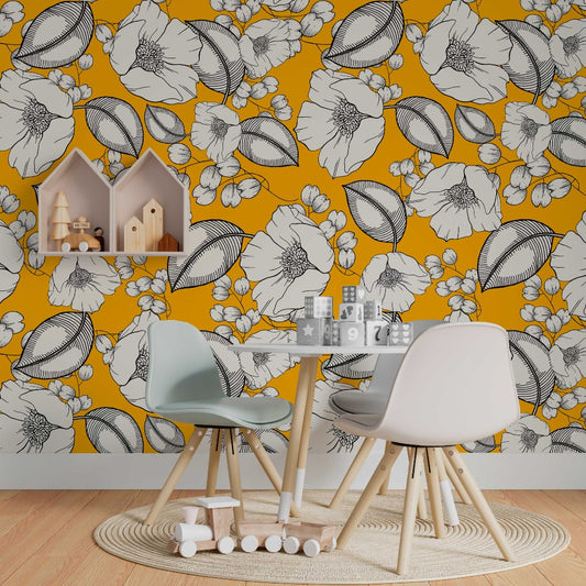 A vibrant children's play area with a Decor2Go Wallpaper Mural adorned with large white floral patterns, two modern chairs, a wooden table with toys, and house-shaped shelves are present.