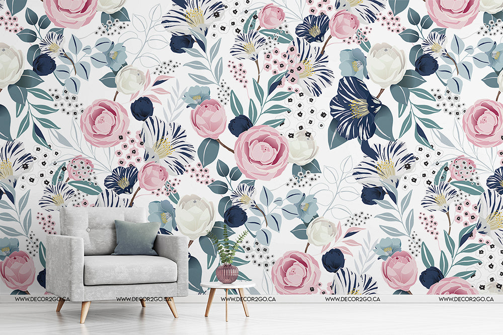 A stylish room featuring a wall adorned with Decor2Go Wallpaper Mural's Air Balloon Whale Wallpaper Mural in soft pink, blue, and white tones, complemented by a modern gray armchair and a small potted plant on a wooden stand.