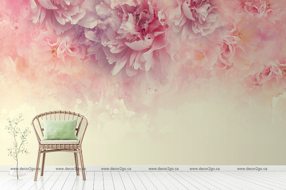 A serene room with a large Decor2Go Wallpaper Mural in shades of pink and orange. To the right, a simple wooden chair with a green cushion sits beside a small plant.