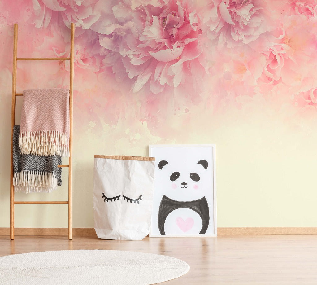 A cozy room corner featuring a wooden ladder with a draped blanket, a white storage bag with eyelashes design, a panda painting against the wall, and a circular rug on the floor with Decor2Go Wallpaper Mural's Rose Peonies Wallpaper Mural.