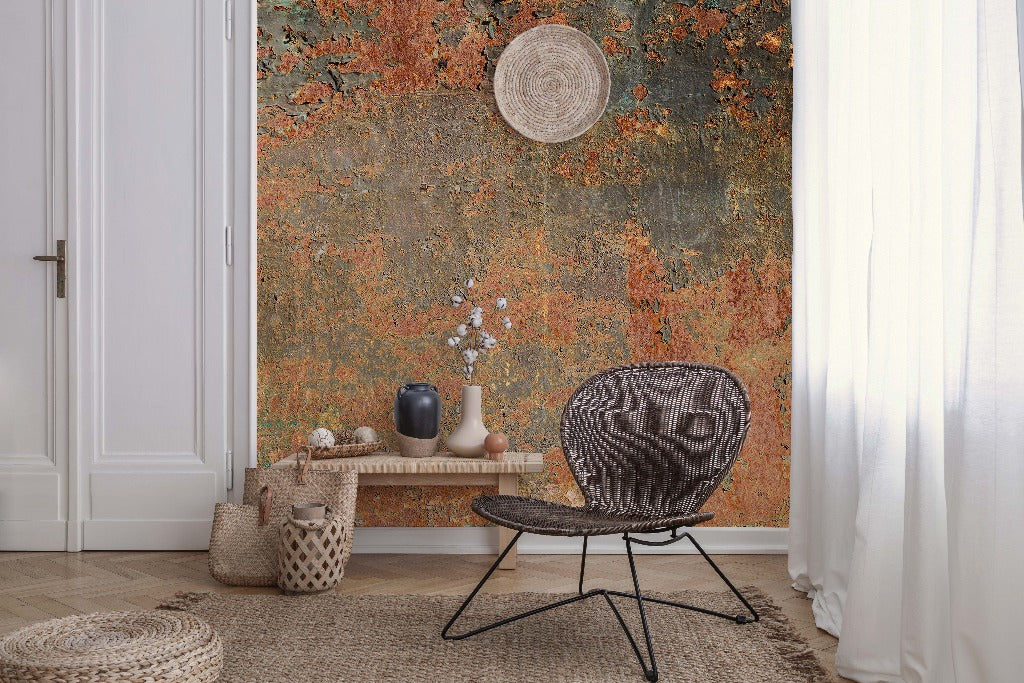 A modern living room with a Decor2Go Wallpaper Mural, featuring a black wire chair, a small table with vases, a woven basket, a floor rug, and a straw hat hanging.