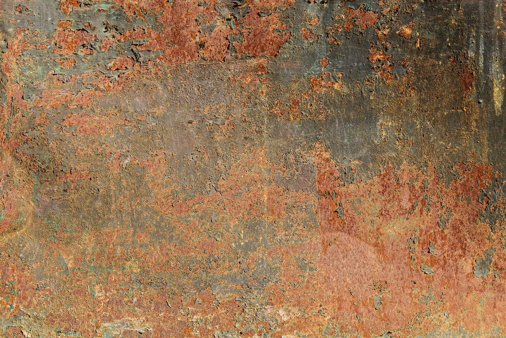 Rusty and weathered metal surface with a mottled pattern of reddish-brown rust and spots, showing signs of corrosion and age. The texture is rough and tactile, indicative of long-term Decor2Go Wallpaper Mural.