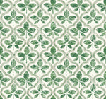 A seamless pattern featuring stylized green leaf clovers arranged in a symmetrical layout. The clovers are textured, giving a slightly distressed look, and are set against an off-white background with light green and beige accents forming a wave-like border around them. This Sevilla Ochre Wallpaper Yellow (60 Sq.Ft.) is perfect for York Wallcoverings using SureStripª technology.