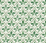 Seamless pattern featuring green shamrocks with a textured, distressed look on a light background. The shamrocks are arranged in a repeating, interlocking design with white and light green accents, adding geometric elegance. Ideal for York Wallcoverings Sevilla Clover Wallpaper Green (60 Sq.Ft.) installations.