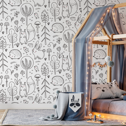 A cozy children's bedroom corner featuring a wooden canopy bed with sheer drapes and string lights, a patterned rug, whimsical Sketchbook Garden Wallpaper Mural from Decor2Go Wallpaper Mural with forest-themed illustrations, and a plush toy on.