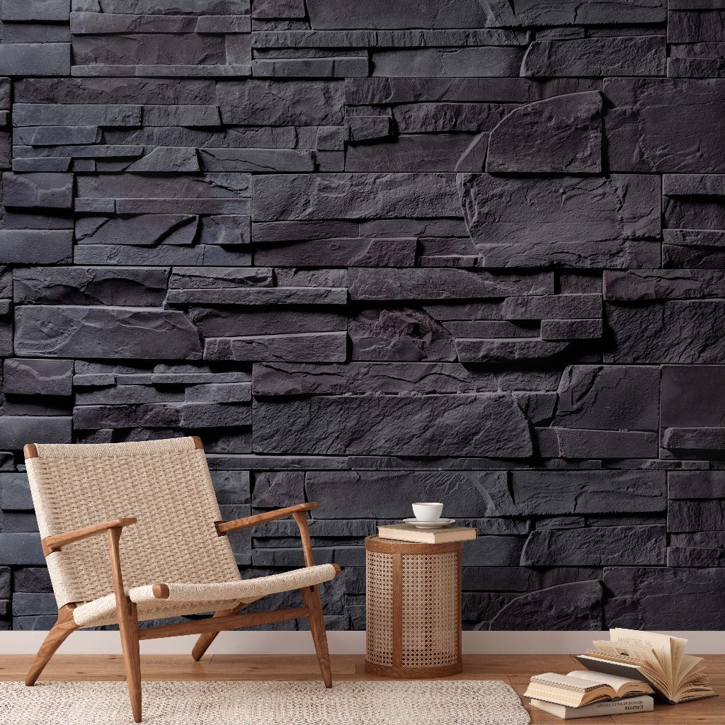 A cozy nook with a beige armchair and a small wooden side table holding a white cup, against Decor2Go Wallpaper Mural. An open book lies on the floor nearby.