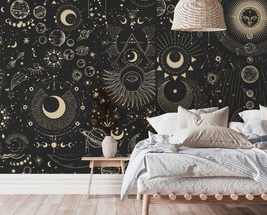 Bedroom - A stylish bedroom featuring a large bed with white bedding and a wall adorned with an intricate Decor2Go Wallpaper Mural, showcasing suns, moons, and stars in gold on a black background.