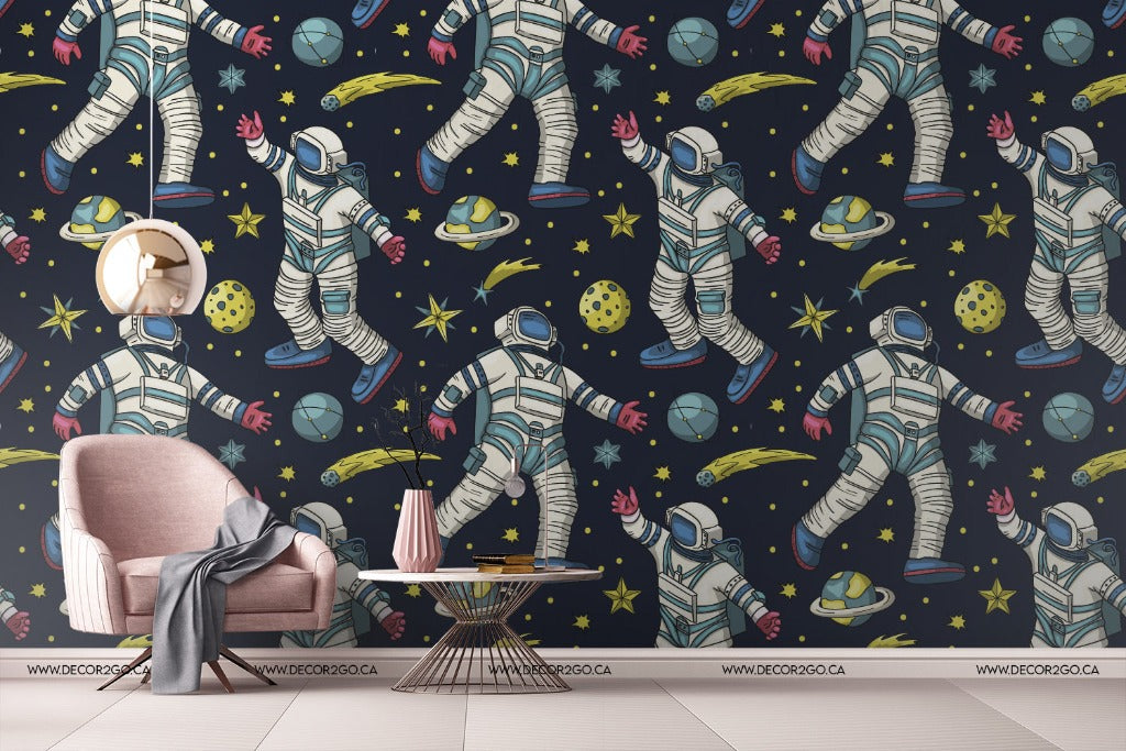 Bedroom - A stylish room featuring a wall covered in Decor2Go Wallpaper Mural's Space Dream Wallpaper Mural, specifically designed as bedroom wall decor, a pink armchair, a gray throw blanket, and a small round coffee table with a vase and