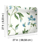 A roll of York Wallcoverings Springtime Midnight/Multi Wallpaper Black, Blue (60 Sq.Ft.) featuring a whimsical floral pattern with green leaves and blue flowers on a white background is displayed. Dimensions are 27 inches (68.58 cm) wide by 27 feet (8.23 meters) long, ensuring easy installation.