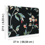 A York Wallcoverings Springtime Midnight/Multi Wallpaper Black, Blue (60 Sq.Ft.) featuring a whimsical floral design with colorful flowers and green leaves. The roll is partially unrolled to display the pattern. Measurements indicate the wallpaper is 27 feet (8.23 meters) long and 27 inches (68.58 centimeters) wide, ensuring easy installation for a fresh look.