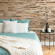 Bedroom - A cozy bedroom corner featuring a bed with teal and white bedding, a white knit throw, and a bedside table with a vase of white flowers against Decor2Go Wallpaper Mural. An open book lies on the.