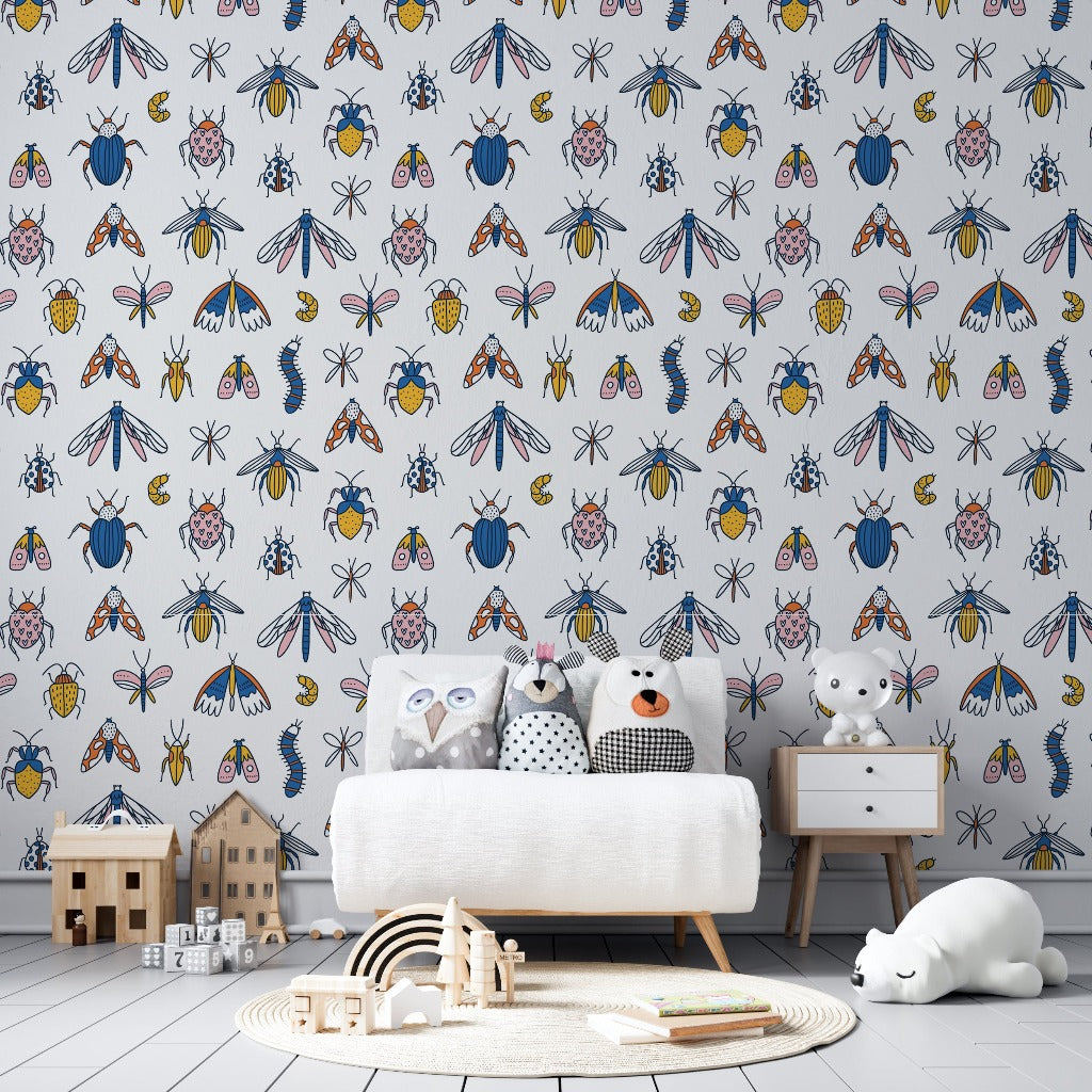 Kids Room - A colorful children's room featuring a feature wall with vibrant Decor2Go Wallpaper Mural, a white sofa adorned with cute animal cushions, a wooden toy house, and a sleeping toy cat on the rug.