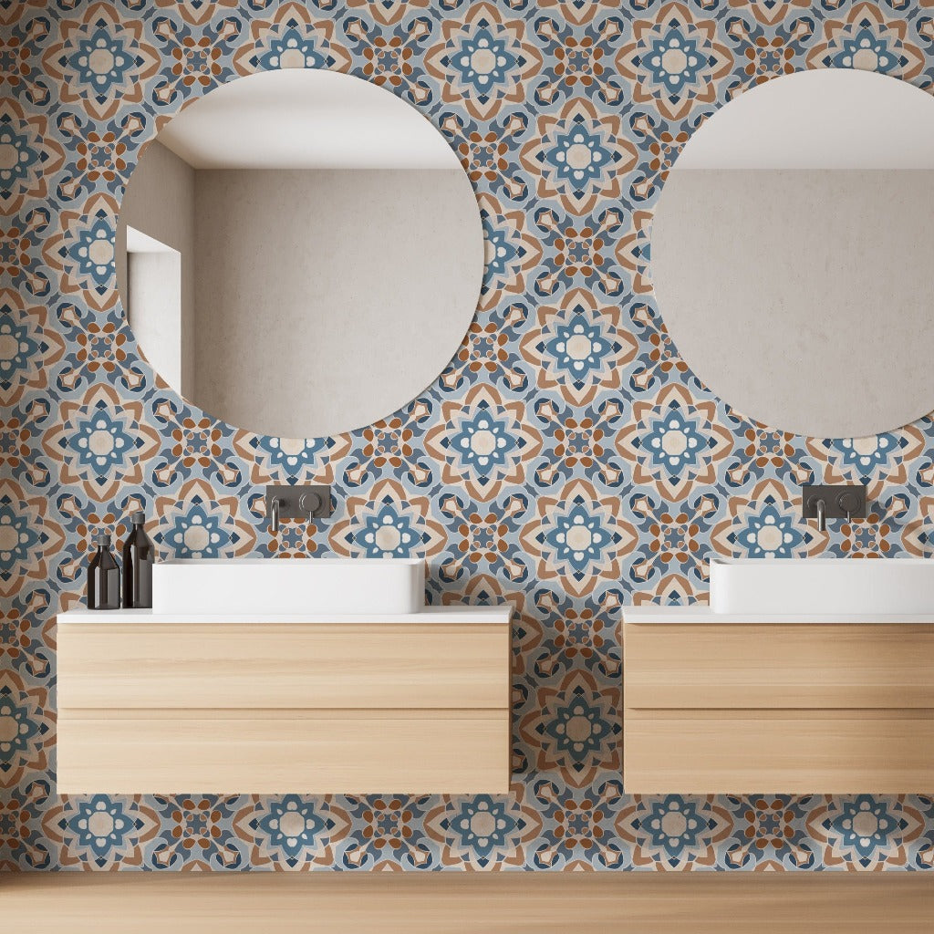 Two round mirrors above wooden bathroom vanities with white sinks, against a feature wall with intricate Decor2Go Wallpaper Mural Moroccan-style tiles.