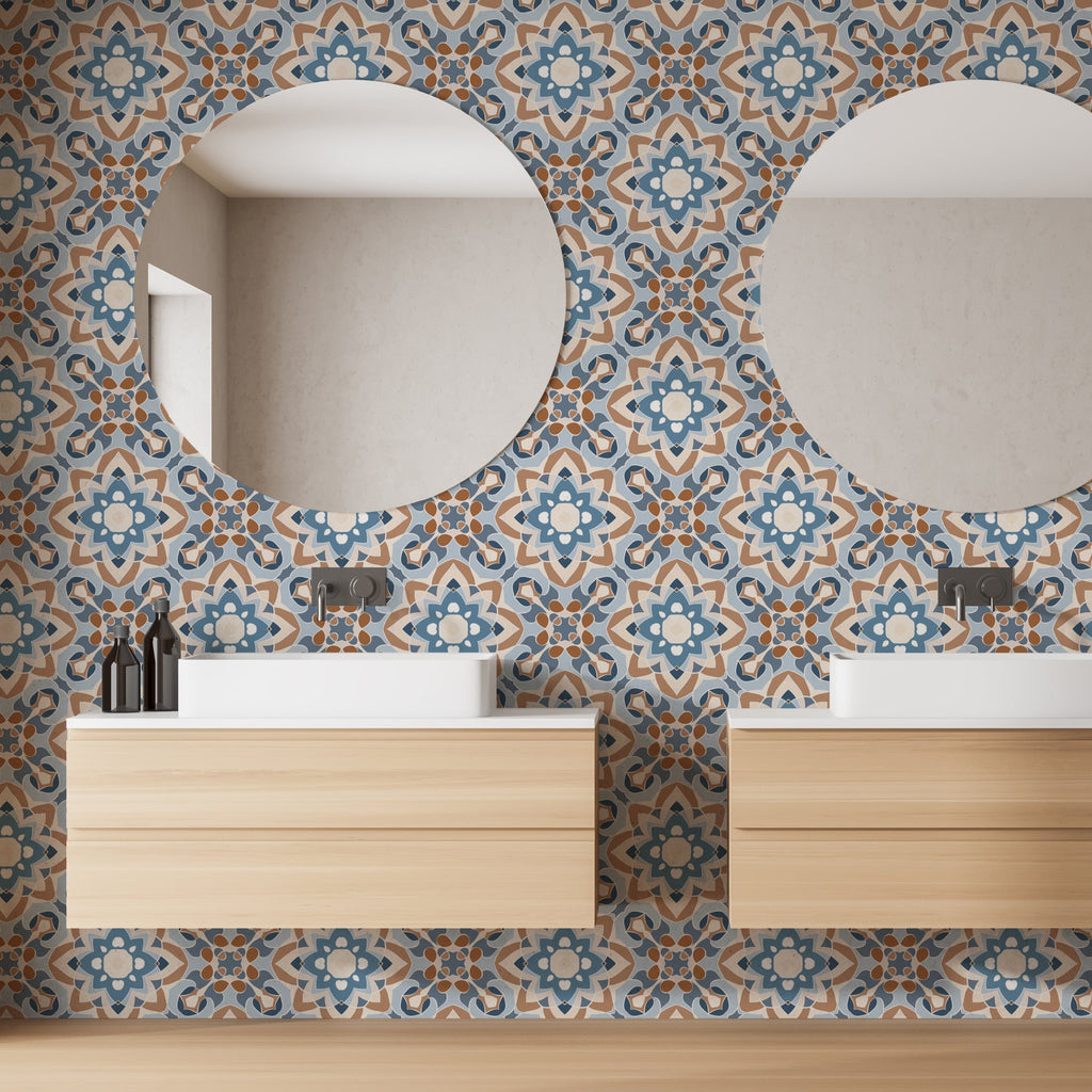 Two round mirrors above wooden bathroom vanities with white sinks, against a feature wall with intricate Decor2Go Wallpaper Mural Moroccan-style tiles.
