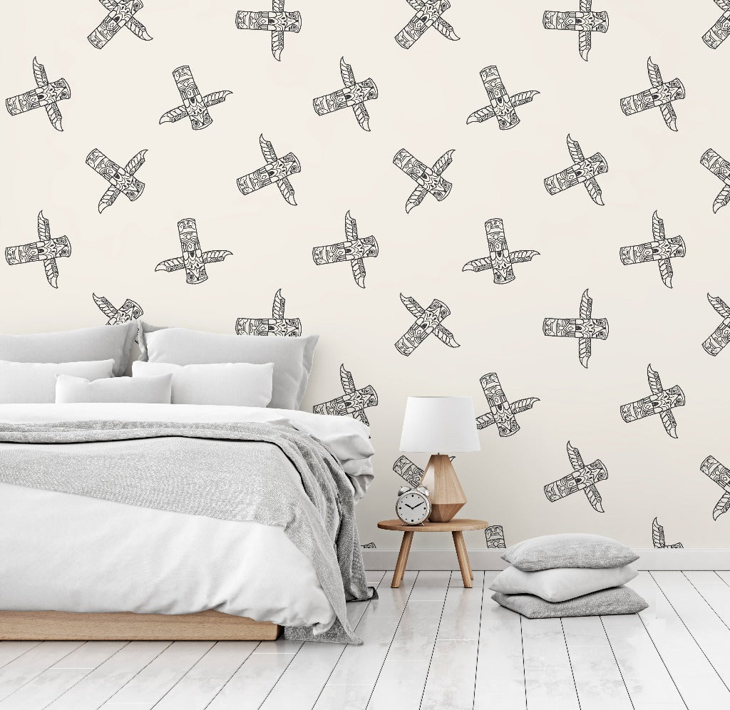 A minimalist bedroom with a white bed covered in gray bedding, next to a wooden bedside table featuring a white lamp and a clock, set against a wall with Decor2Go Wallpaper Mural inspired by Canadian culture.