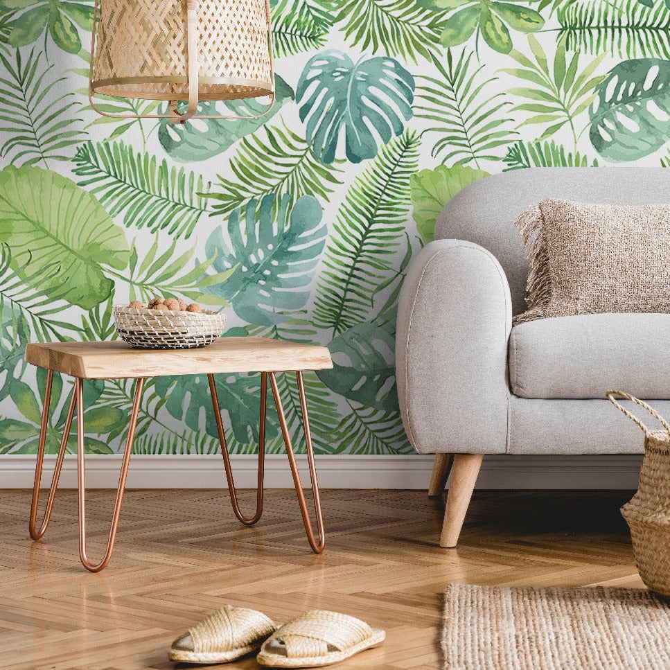 Green tropical leaves pattern wallpaper mural. Seamless floral leaves wallpaper murals in the living room
