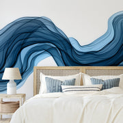 Bedroom - A serene bedroom featuring an elegant bed with a patterned headboard, flanked by two nightstands with lamps. A flowing, Decor2Go Wallpaper Mural adorns the wall above the bed.