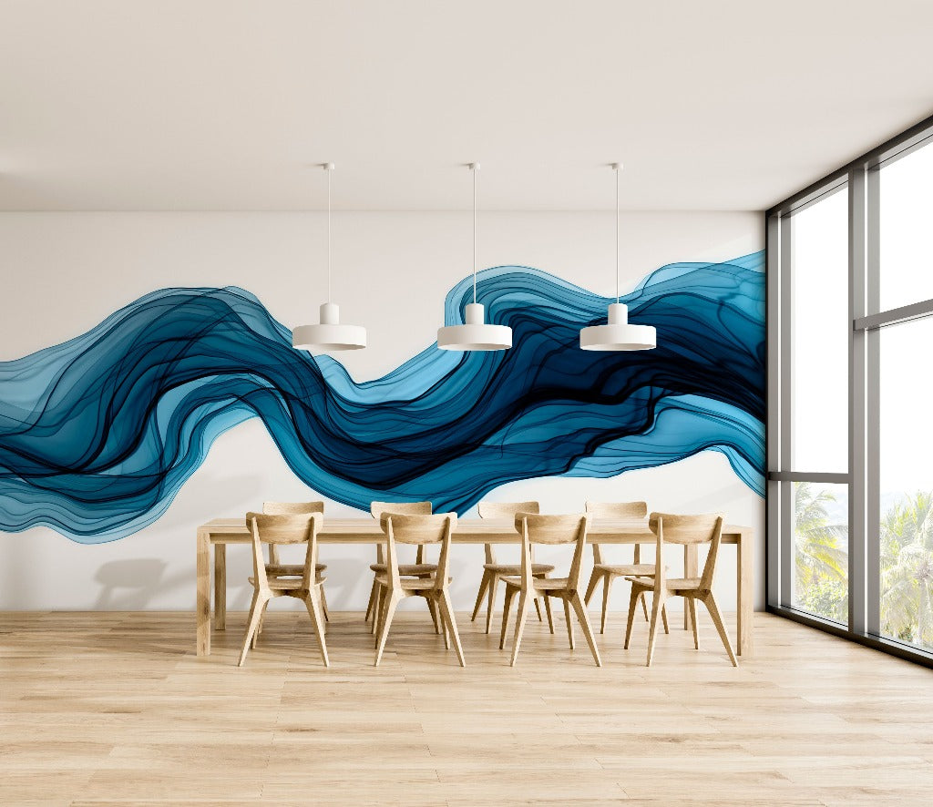 Dining Room - A minimalist dining room with a large Decor2Go Wallpaper Mural depicting an abstract blue wave on the feature wall, wooden chairs around a rectangular table, pendant lights, and a window with a view of greenery.