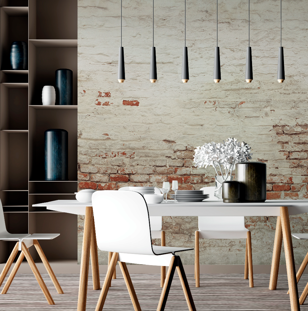 Modern dining room featuring a white table with Scandinavian-style chairs, Decor2Go Wallpaper Mural, and sleek pendant lights. Decor includes a vase with white flowers and an elegant shelving unit.