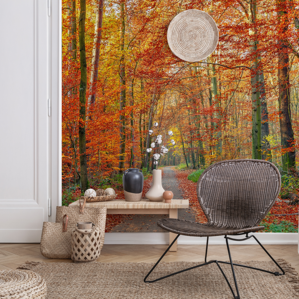 A cozy room featuring a Decor2Go Wallpaper Mural. Interior includes a woven chair, a wooden bench with vases, a round mirror, and rugs on a wooden floor.